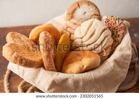 Group of assorted mexican sweet bread, traditional mexican bread. Royalty-Free Stock Photo #2302051565