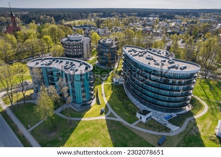 Aerial view of Druskininkai city in Lithuania during summer day, which is a popular tourist destination due to variety of Spa and health facilities and famours for it's natural mineral water Royalty-Free Stock Photo #2302078651