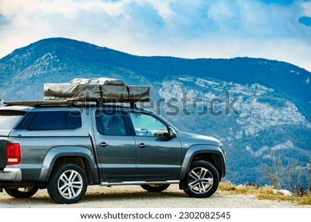 Off road 4x4 car equipped with camping gear and roof tent driving through mountain, Verdon Gorge in France. Royalty-Free Stock Photo #2302082545