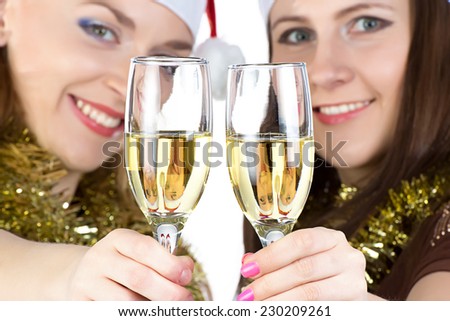 Portrait of smiling women with the glasses on white background