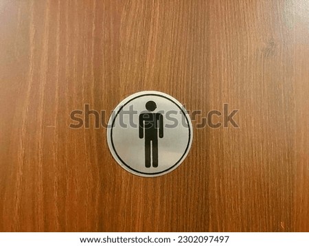 The Washroom sign of a Male and Female on a door