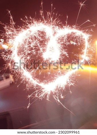 long exposure love picture using fireworks at night