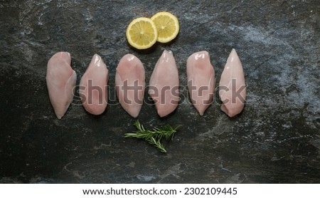 Lay flat photo of selective chicken meat cuts displayed to make it look appetizing and ready to cook.