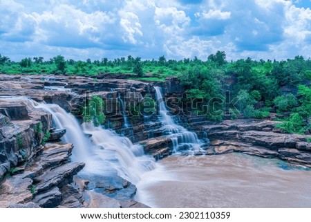 Long Exposure of Shabri waterfall (Shabri Jal Prapat) or Tulsi waterfall  in Chitrakoot district of Uttar Pradesh. It's one of the most beautiful places in the Bundelkhand region near Madhya Pradesh. Royalty-Free Stock Photo #2302110359