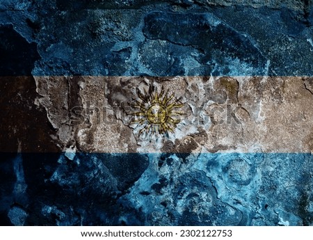 Argentinian flag on a rusty wall.