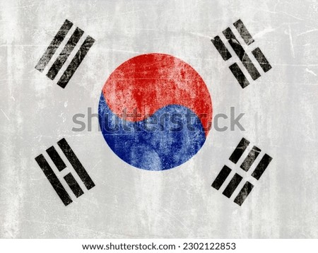 South Korean flag on white concrete wall.