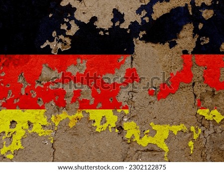 German flag on mud wall.