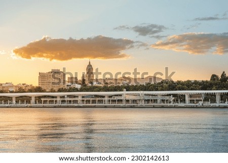 Malaga Skyline with Malaga Cathedral and Paseo del Muelle Uno at sunset - Malaga, Andalusia, Spain