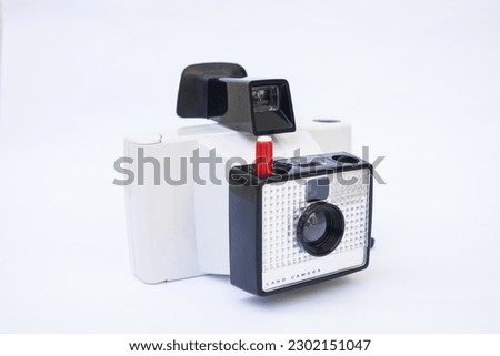 Vintage instant camera on the white background