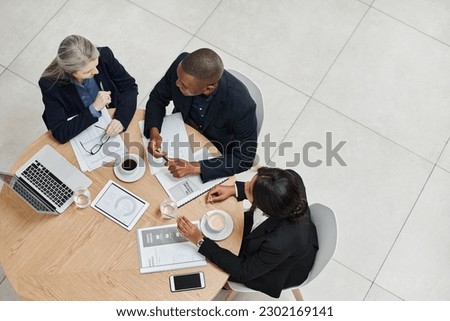 Top view, team and employees planning, collaboration and brainstorming for new project, discussion and partnership. Coworkers, black man and women share ideas, feedback and meeting with development Royalty-Free Stock Photo #2302169141