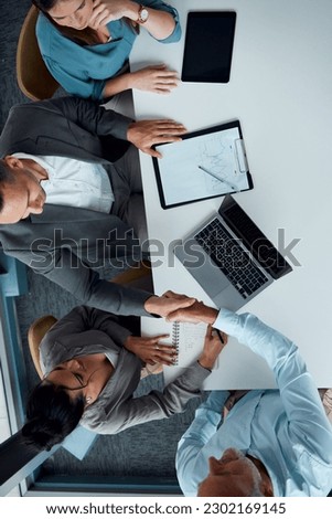 Business people, handshake and laptop for top view meeting, partnership deal and b2b interview collaboration in office. Contract, onboarding celebration and shaking hands for agreement or welcome Royalty-Free Stock Photo #2302169145