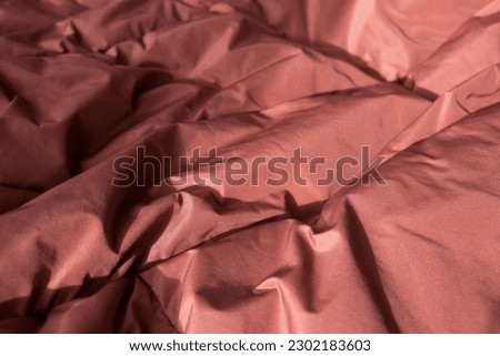 Texture fabric. Textile brown knitted cloth background.