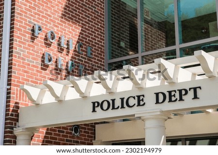 Police department sign at police station Royalty-Free Stock Photo #2302194979