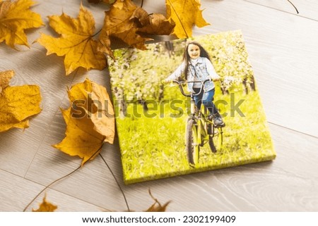Blank square canvas frame on autumn background. Mockup poster with colourful autumn leaves