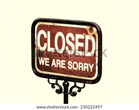 old sign, words closed we are sorry