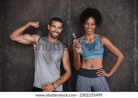 Fitness, muscle flex and portrait of couple in city after workout, body builder training and exercise. Sports, water bottle and man and woman sweating after running for endurance, wellness and energy Royalty-Free Stock Photo #2302235499