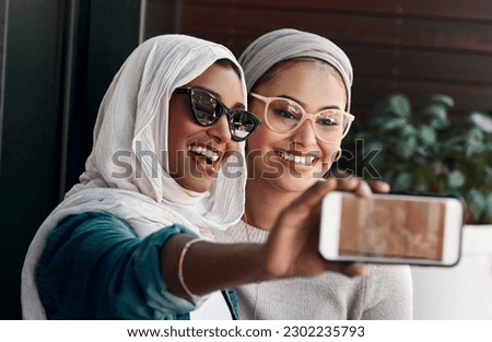 Selfie, muslim people and friends with sunglasses in city for social media, influencer content creation or fashion blog. Happy gen z women in Saudi Arabia, emoji profile picture or online photography