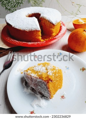 slice of citrus cake with orange and tangerine and  white background