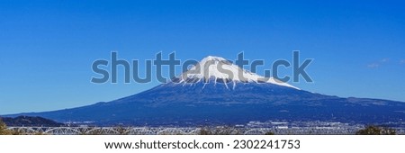 Mt. Fuji viewed from Fuji river in Fuji-shi, Shizuoka, Japan. Royalty-Free Stock Photo #2302241753