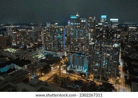 Night urban landscape of downtown district of Atlanta city in Georgia, USA. Skyline with brightly illuminated high skyscraper buildings in modern american megapolis