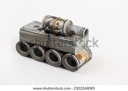 Conceptual plot about the profit of the military-industrial complex with a tank made from american dollars Royalty-Free Stock Photo #2302268085