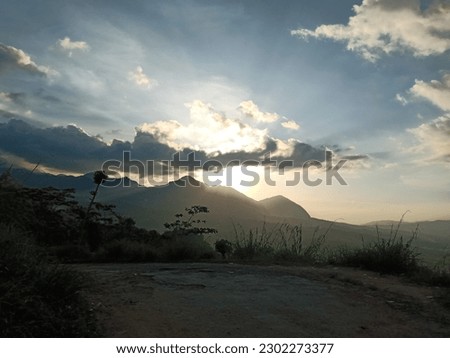 beautiful sunset with mountain and sky, this picture take in way puncak jonggol, Indonesia