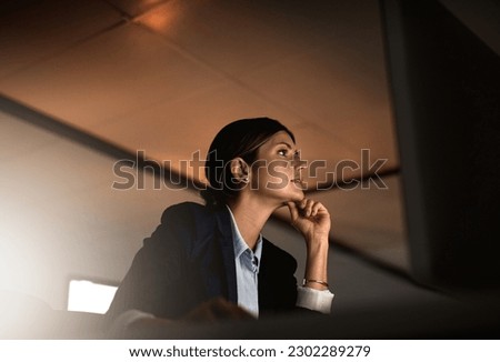 Thinking, ideas and problem solving at night, woman in office reading email or online report at start up agency. Corporate overtime, challenge and focus, businesswoman at desk working late on idea.