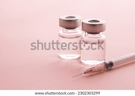 
Syringe and vial on pink background. Image of cosmetic medicine and cosmetic surgery. Royalty-Free Stock Photo #2302303299