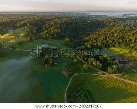 Mystical Sunrise Drone View of Lush Green Landscape of Northern Europe Royalty-Free Stock Photo #2302317107