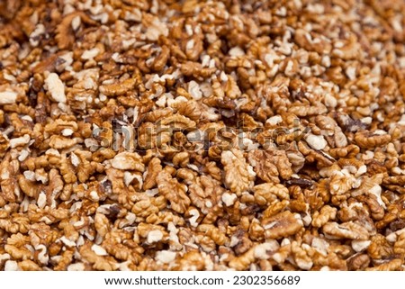 Close-up on a stack of Walnut kernels for sale on a market stall.