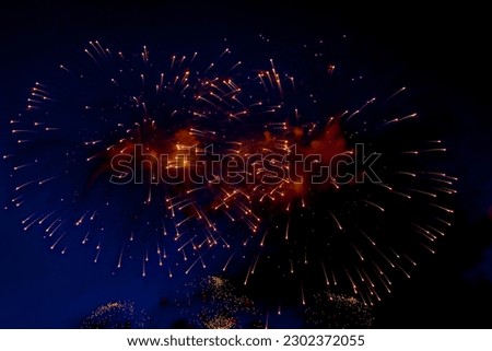 Amazing beauty colorful fireworks display on celebration, showing. Holiday fireworks backgrounds with sparks, colored stars and bright nebula on black night sky universe, comets. Holidays backgrounds