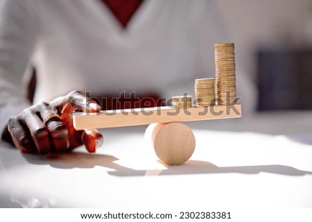 African American Financial Saving Balance And Stacked Coins
