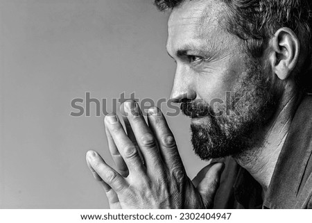 Man's brutal portrait in photo studio on white background in black and white colors. Handsome concept. High quality photo Royalty-Free Stock Photo #2302404947