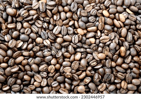 Pattern of the roasted organic Cocoa Beans Background Stock Photo, Picture. 