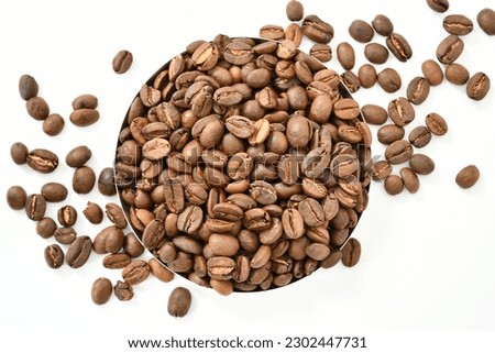 Roasted organic Cocoa Beans on white Background Stock Photo, Picture. top view. 