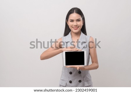 Beautiful woman using tablet over white background, technology concept. 	
