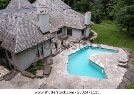 Experience ultimate relaxation in backyard oasis with a luxury swimming pool. From stunning drone backyard pictures opulent luxury houses, enjoy the perfect combination of comfort and style