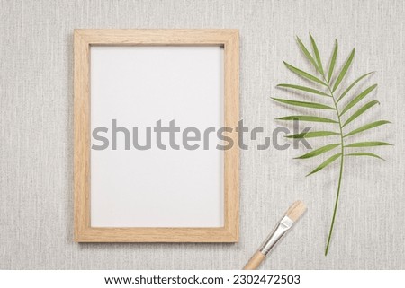 Photo frame on a wall with empty space in portrait mode. To write a message, invitation, greetings, photography.