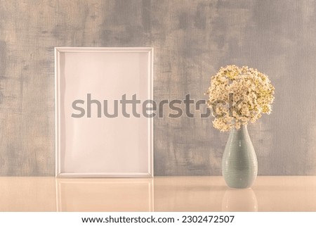 Photo frame on a wall with empty space in portrait mode. To write a message, invitation, greetings, photography.