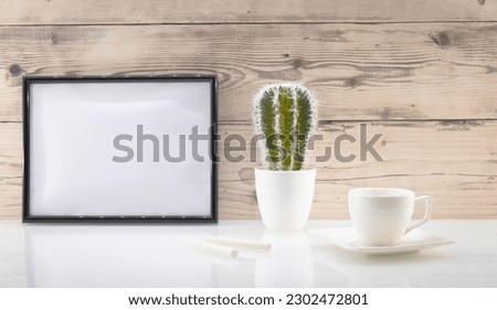 Photo frame on a wall with empty space in landscape mode. To write a message, invitation, greetings, photography.