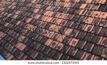 Roof tiles are flat or curved tiles that are used to cover the roof of a building. They are typically made from materials such as clay, concrete, or slate, and are designed to provide durable and weat
