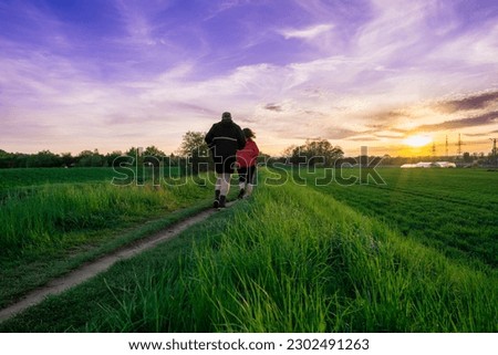 Couple of people that are walking down a path, superrealism, sunset warm spring, running pose. Wonder of devotion, beautiful panoramic photo, man and woman in love, all in the amazing outdoors view