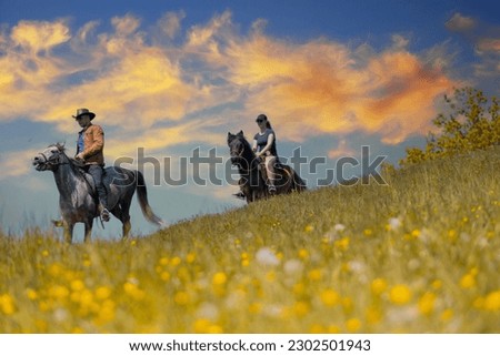 A guy and a girl are riding horses in nature