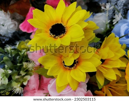 A group of different types of plastic flower. Sun flowers. Multicolor of plastic flowers.