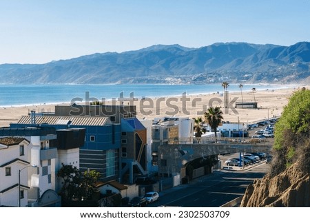 View of Pacific Coast Highway and the Santa Monica Mountains from Palisades Park, in Santa Monica, California Royalty-Free Stock Photo #2302503709