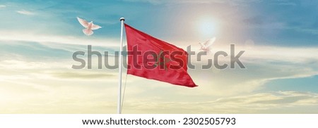 Waving flag of Morocco in beautiful sky. Morocco flag for independence day. Royalty-Free Stock Photo #2302505793
