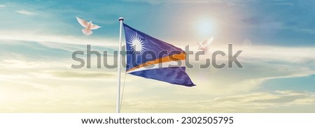 Waving flag of Marshall Islands in beautiful sky. Marshall Islands flag for independence day. Royalty-Free Stock Photo #2302505795