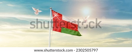 Waving flag of Oman in beautiful sky. Oman flag for independence day. Royalty-Free Stock Photo #2302505797