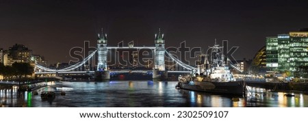 Tower Bridge and HMS Belfast at night. London, United Kingdom.