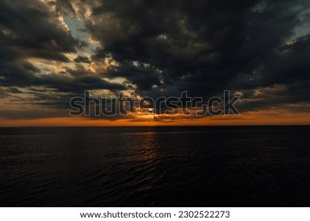 a sea at sunset sky in clouds of sunshine nature boat trip